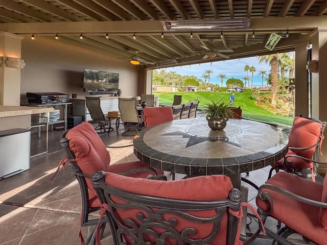 a view of a dining room with furniture window and outside view