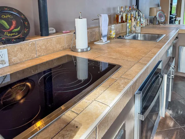 a kitchen with a stove and a sink