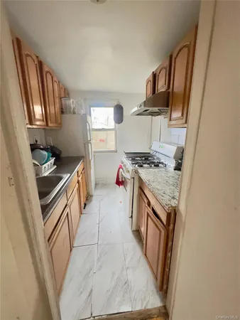 a kitchen with a stove and a sink