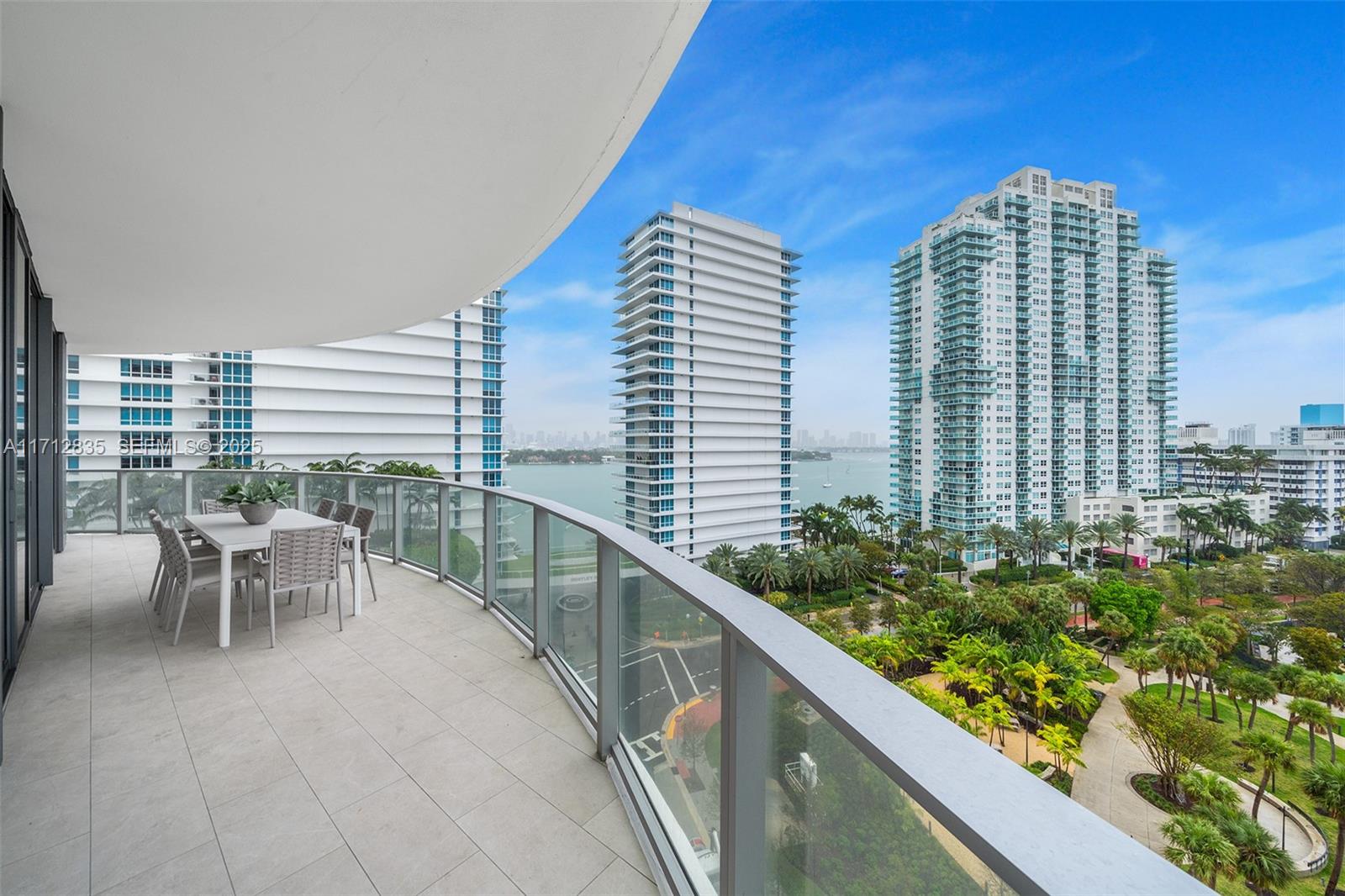 500 Alton Road, Unit 1005 Miami Beach, FL 33139 - Photo 16 of 49 a view of balcony with two chairs and a table