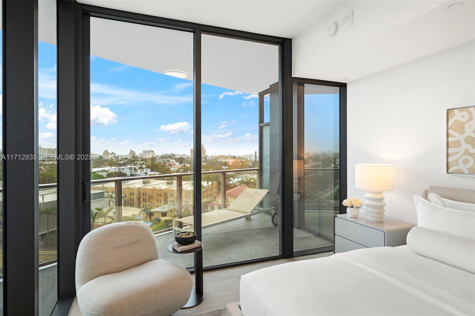 500 Alton Road, Unit 1005 Miami Beach, FL 33139 - Photo 22 of 49 a en suite bathroom with a large window and a bath tub