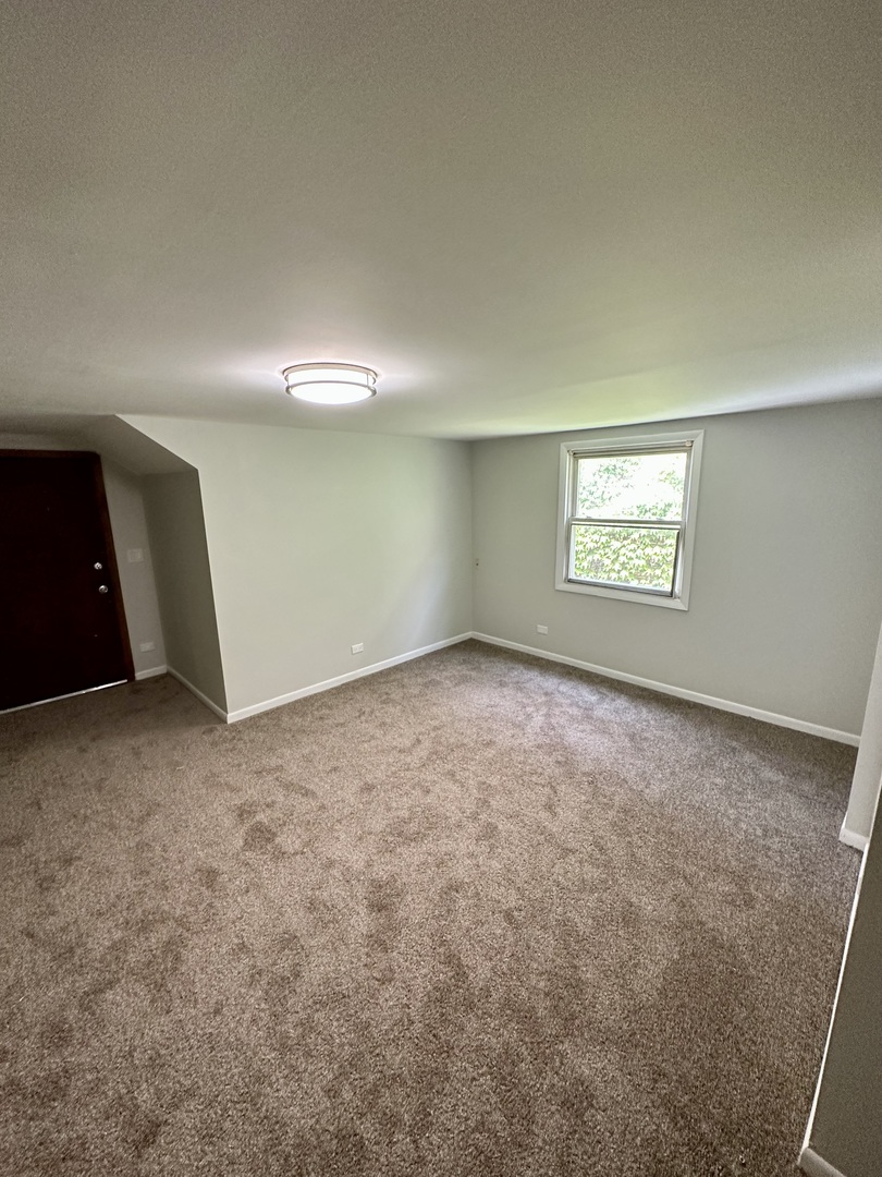 7828 South Carpenter Street Chicago, IL 60620 - Photo 13 of 18 an empty room with a window