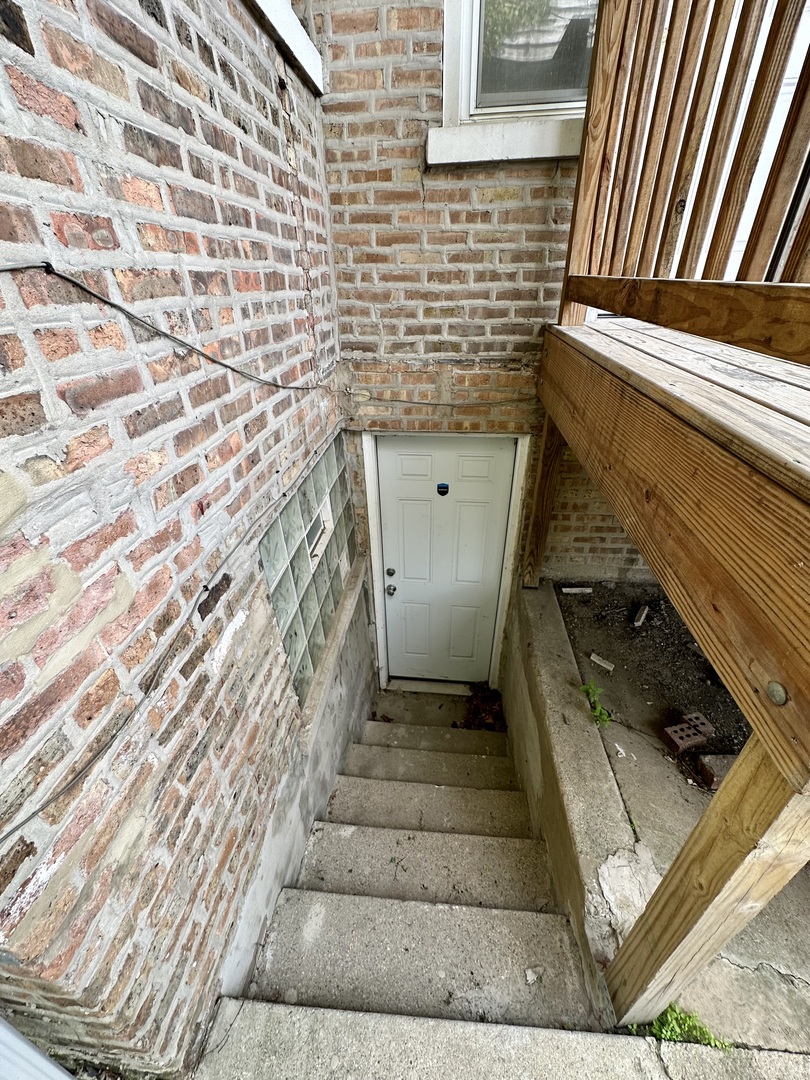7828 South Carpenter Street Chicago, IL 60620 - Photo 17 of 18 a bathroom with a sink and a mirror