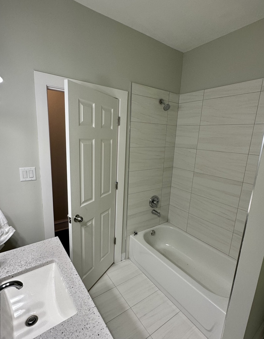 7828 South Carpenter Street Chicago, IL 60620 - Photo 5 of 18 a bathroom with a sink a toilet and shower