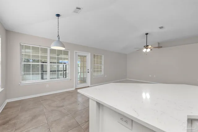 a kitchen that has a sink and a stove