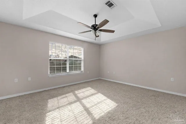a bathroom with a granite countertop sink a toilet and mirror