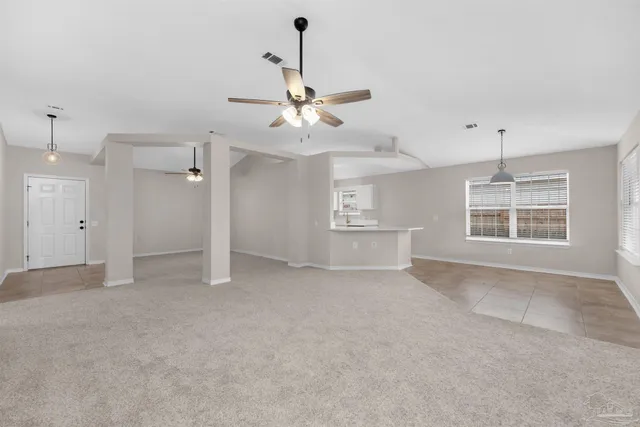 a view of kitchen with stainless steel appliances cabinets
