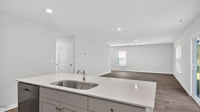 a bathroom with a sink and a large mirror