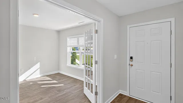 a view of an empty room and window