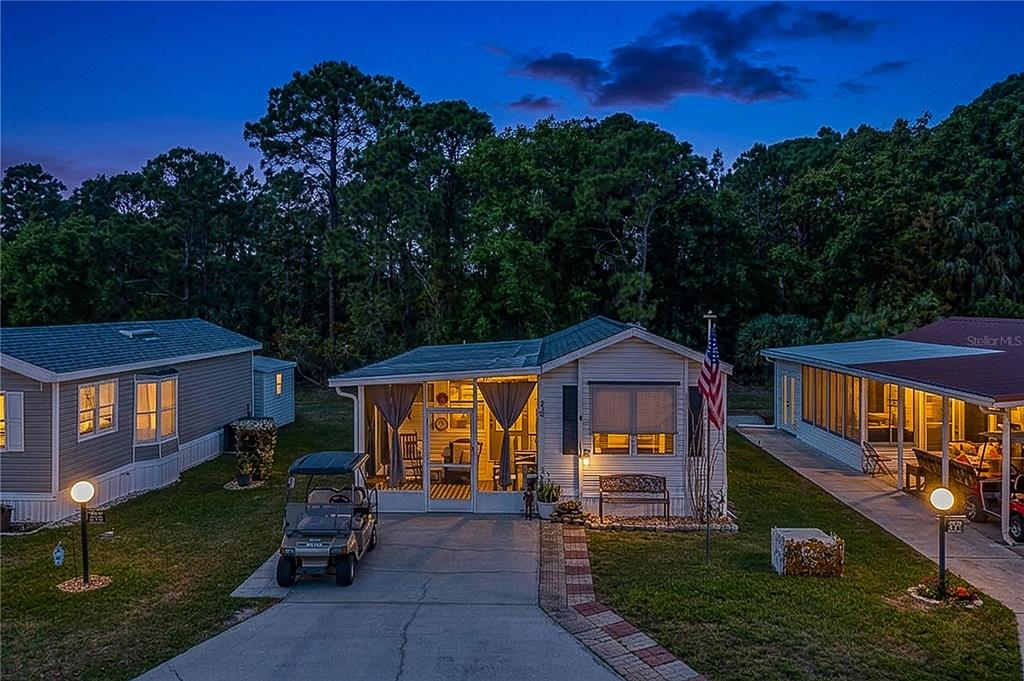 475 Pine Loop Frostproof, FL 33843 - Photo 26 of 40 a front view of a house with garden
