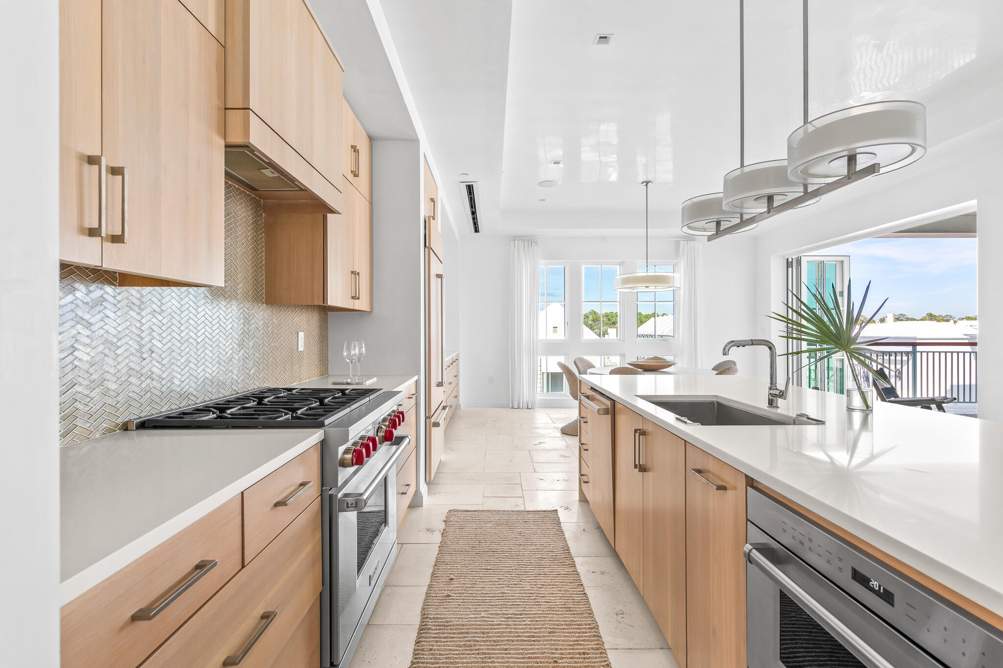 74 Governors Ct Inlet Beach, Unit 304 Inlet Beach, FL 32461 - Photo 16 of 39 a kitchen with stainless steel appliances granite countertop a sink and a stove