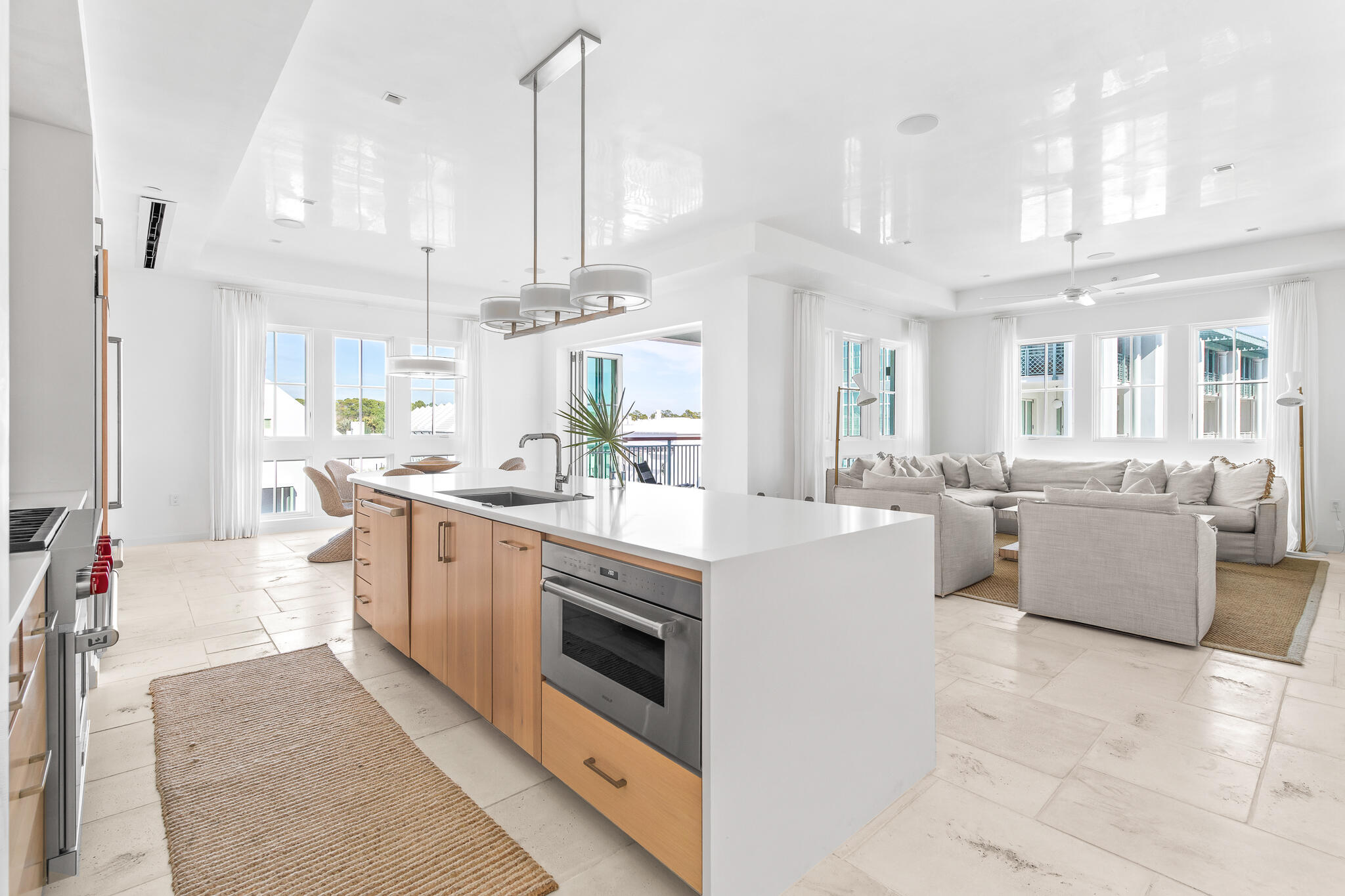 74 Governors Ct Inlet Beach, Unit 304 Inlet Beach, FL 32461 - Photo 2 of 39 a kitchen with stainless steel appliances kitchen island a large counter a sink and a counter top space
