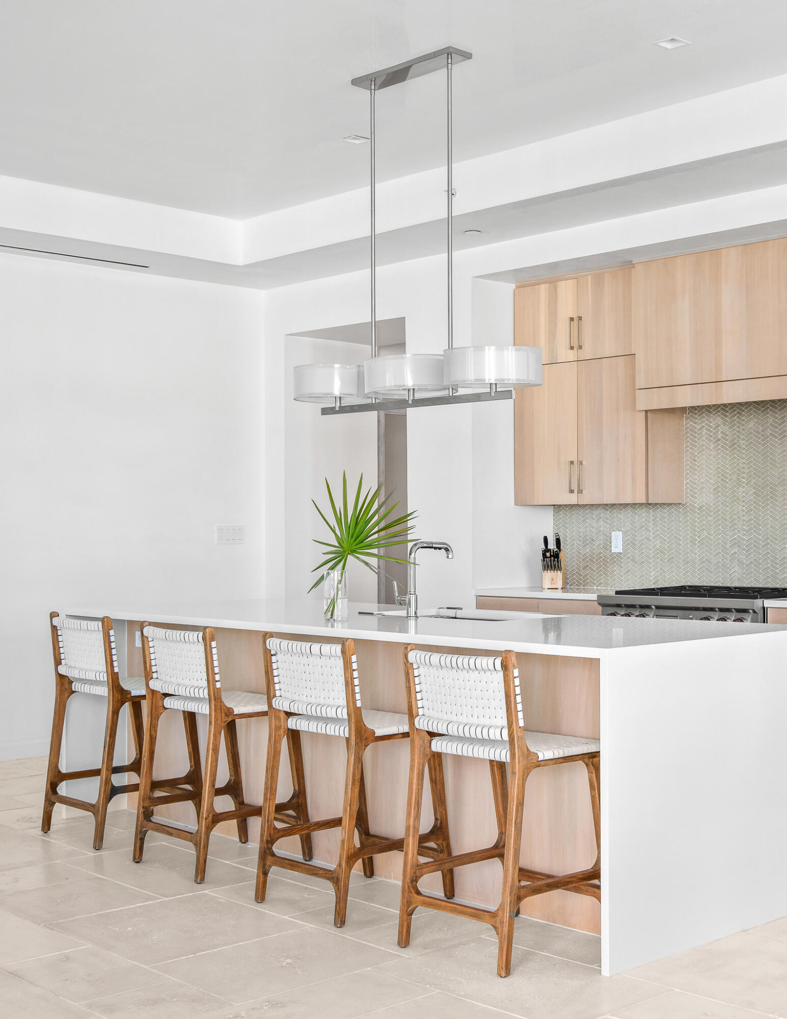 74 Governors Ct Inlet Beach, Unit 304 Inlet Beach, FL 32461 - Photo 28 of 39 a white kitchen with cabinets and chairs