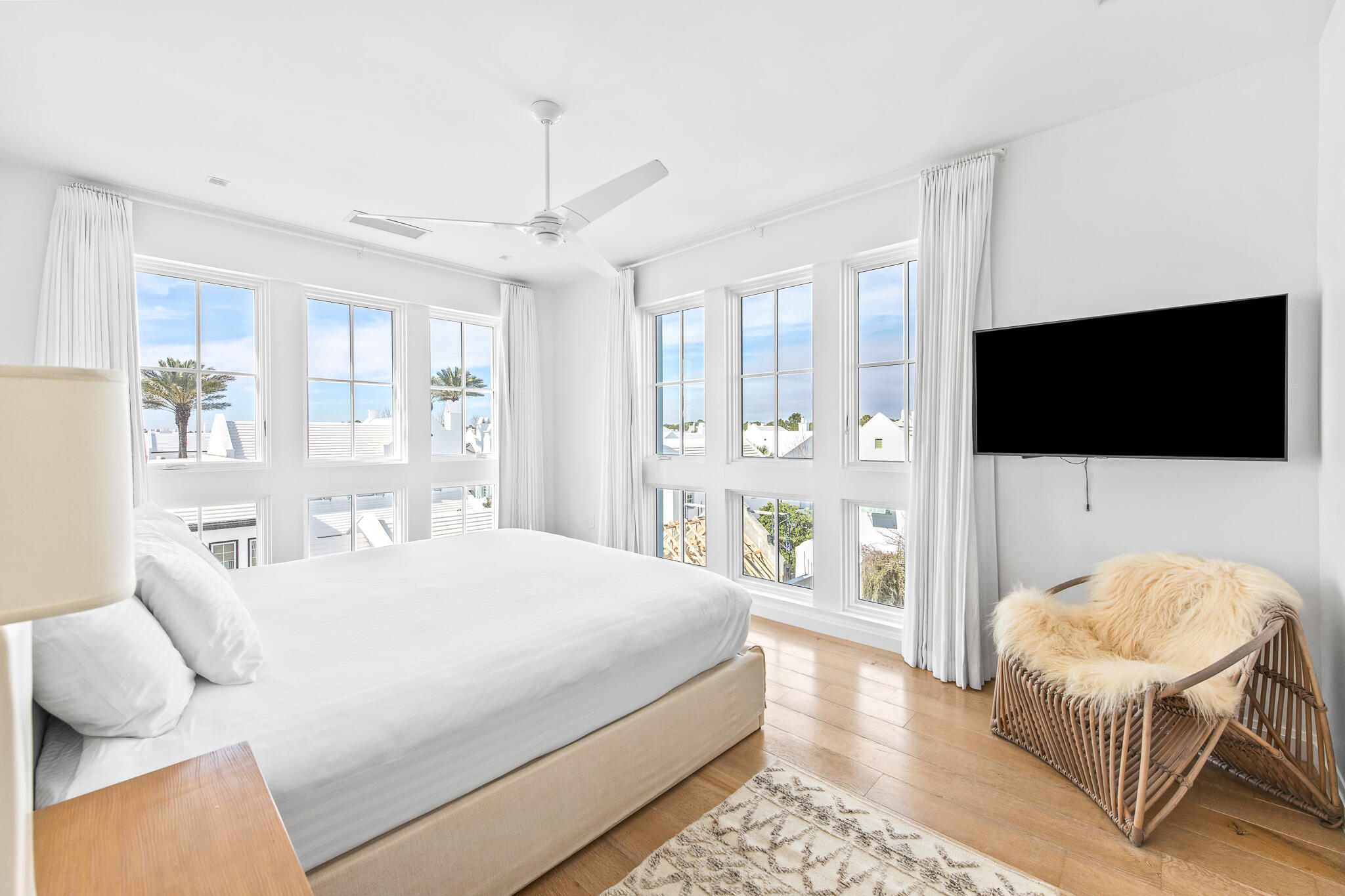 74 Governors Ct Inlet Beach, Unit 304 Inlet Beach, FL 32461 - Photo 4 of 39 a bedroom with a bed and a flat screen tv