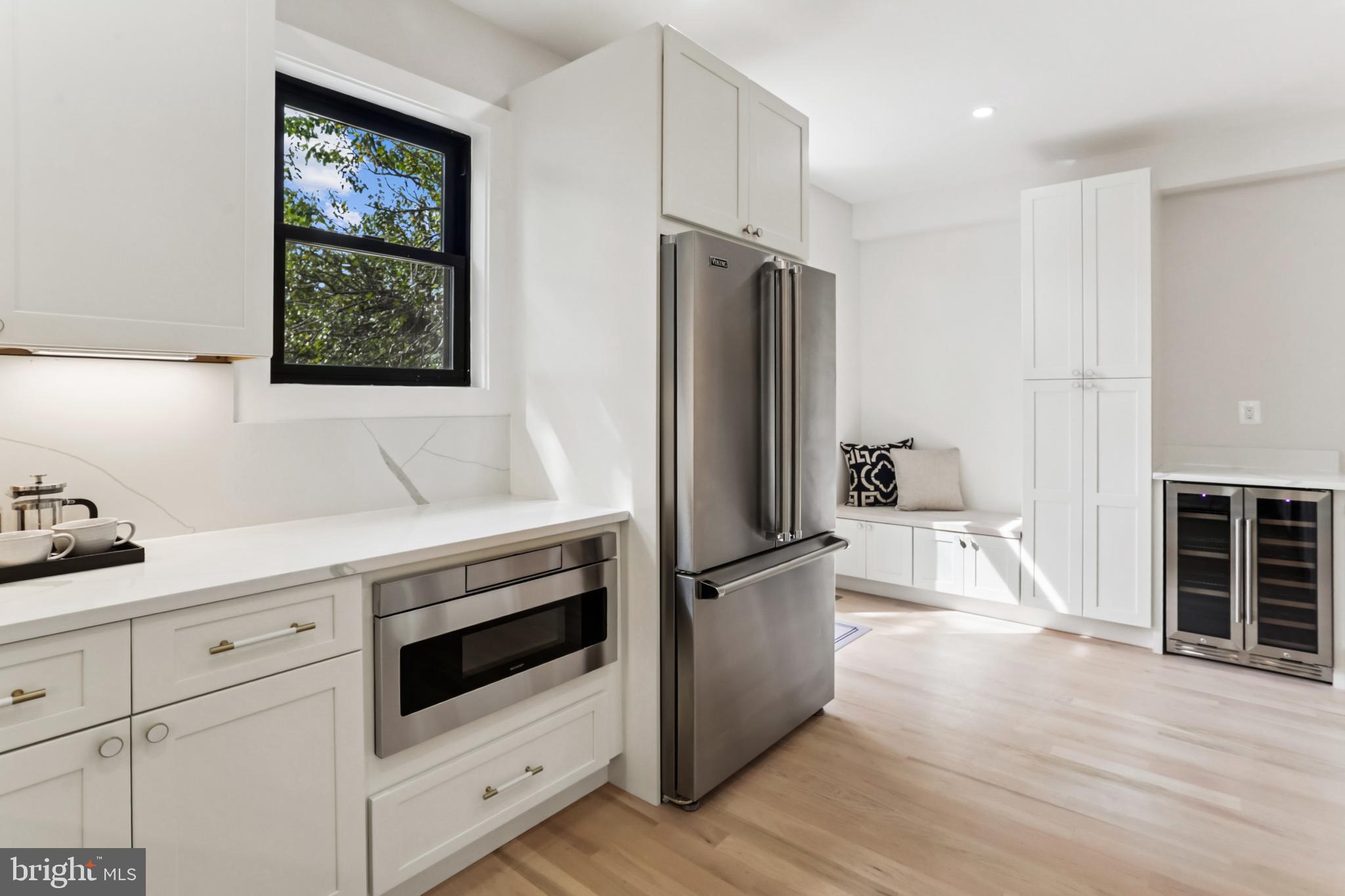 208 Webster Street Northwest Washington, DC 20011 - Photo 11 of 46 a kitchen with granite countertop a refrigerator and a stove top oven