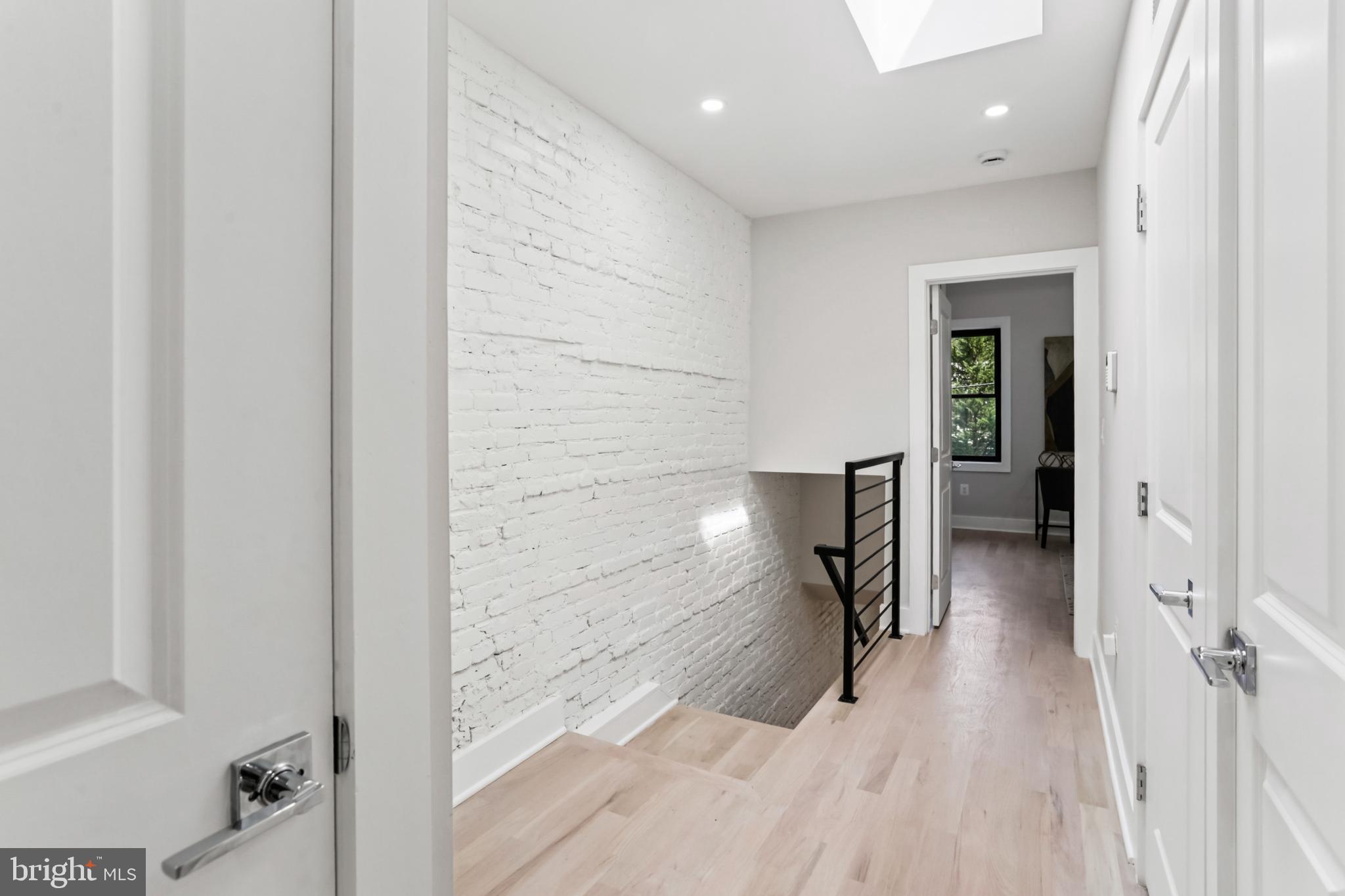 208 Webster Street Northwest Washington, DC 20011 - Photo 16 of 46 a view of a hallway with wooden floor and staircase