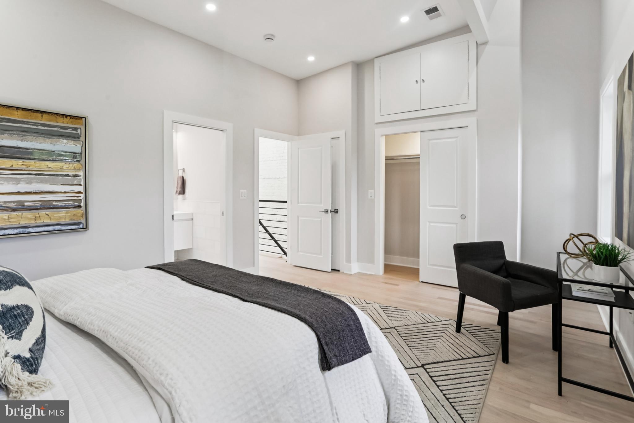 208 Webster Street Northwest Washington, DC 20011 - Photo 19 of 46 a bedroom with a bed and a table