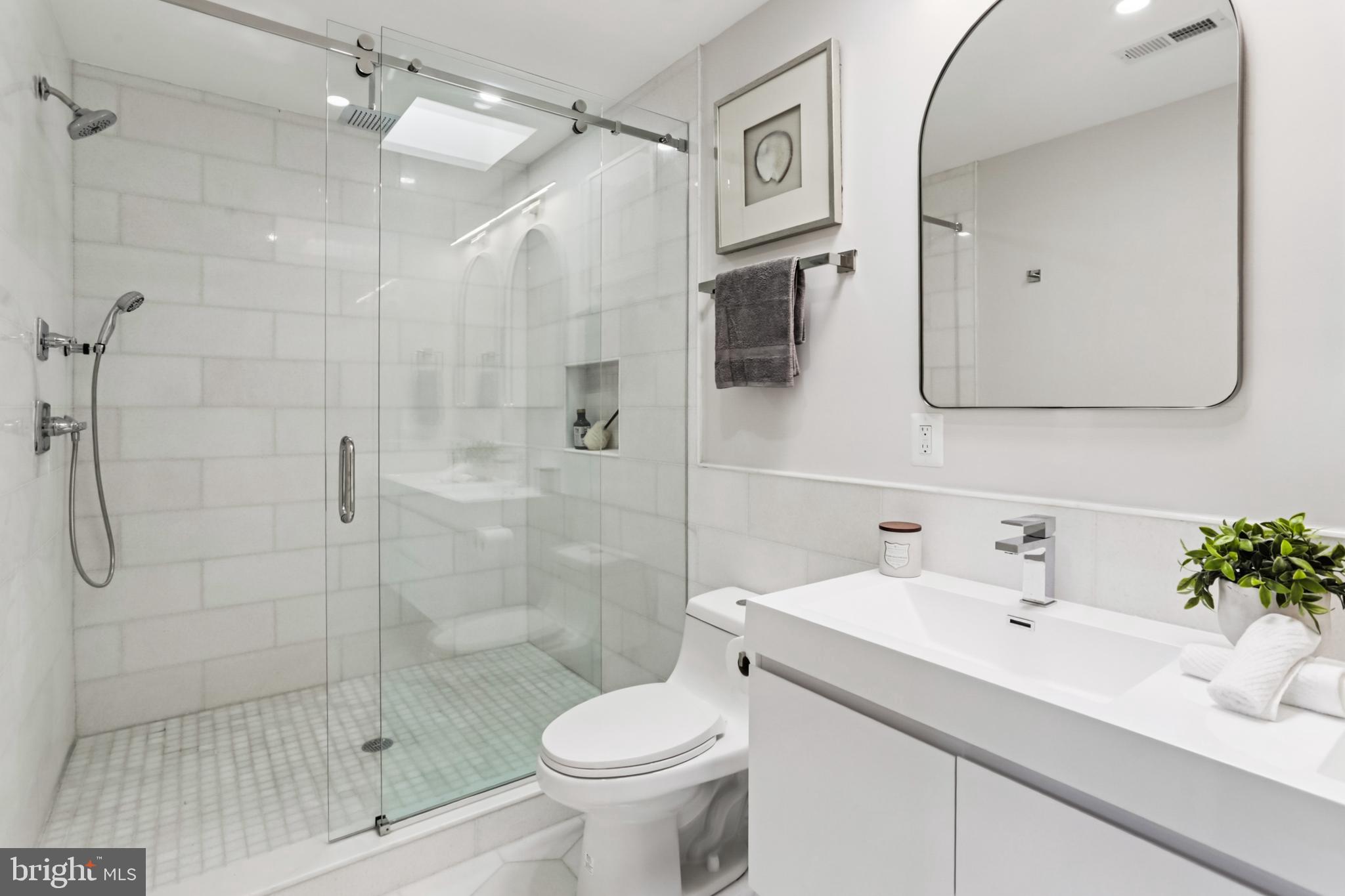 208 Webster Street Northwest Washington, DC 20011 - Photo 21 of 46 a bathroom with a sink toilet and shower