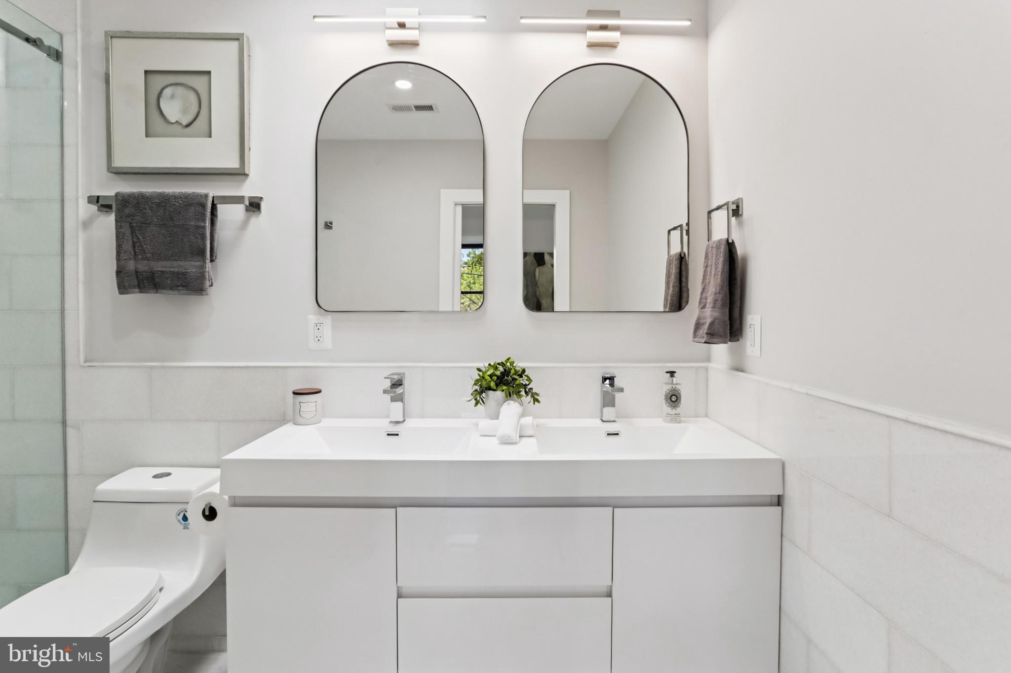 208 Webster Street Northwest Washington, DC 20011 - Photo 22 of 46 a bathroom with a sink and a mirror