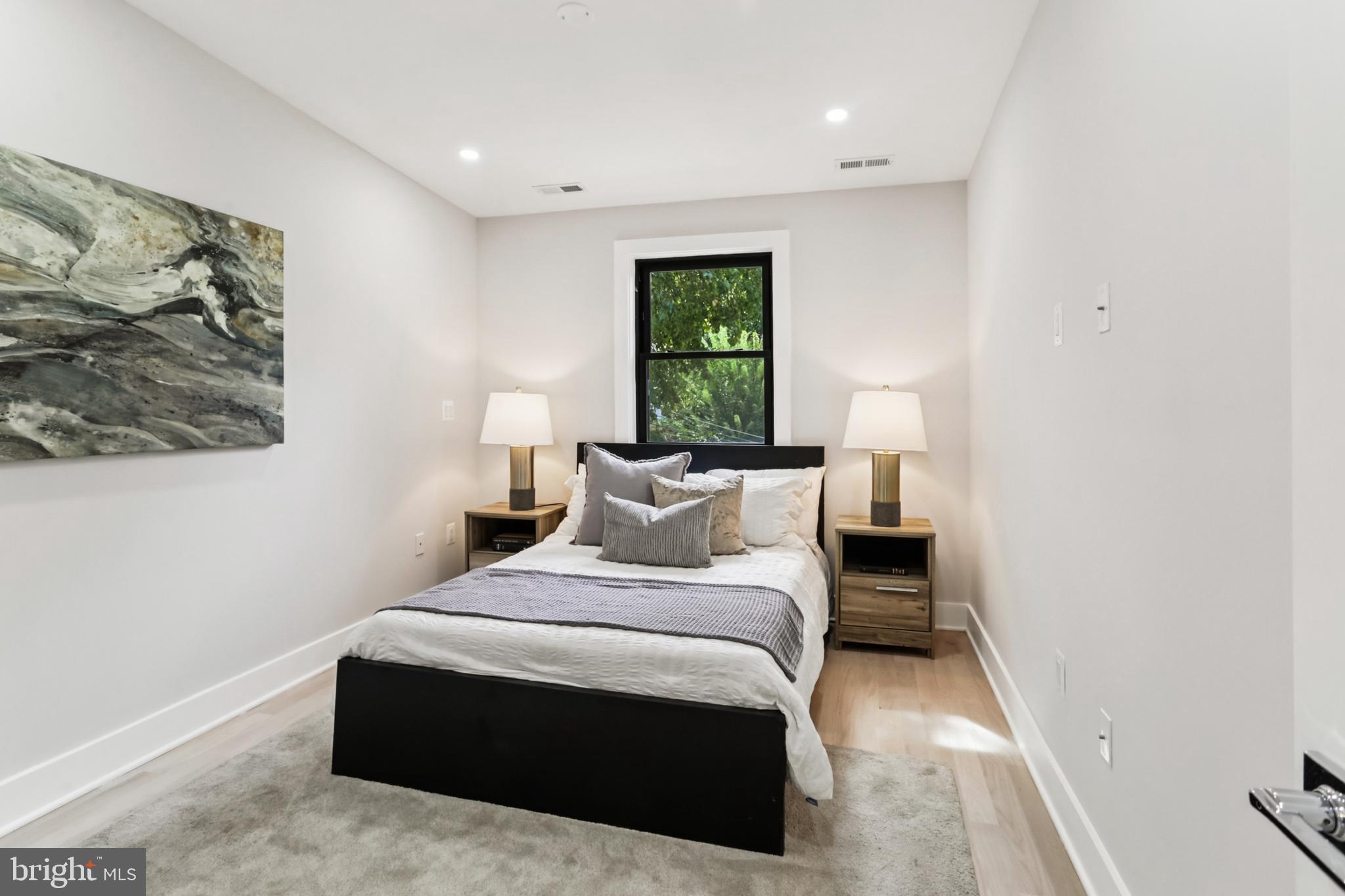 208 Webster Street Northwest Washington, DC 20011 - Photo 24 of 46 a bedroom with a bed and a window