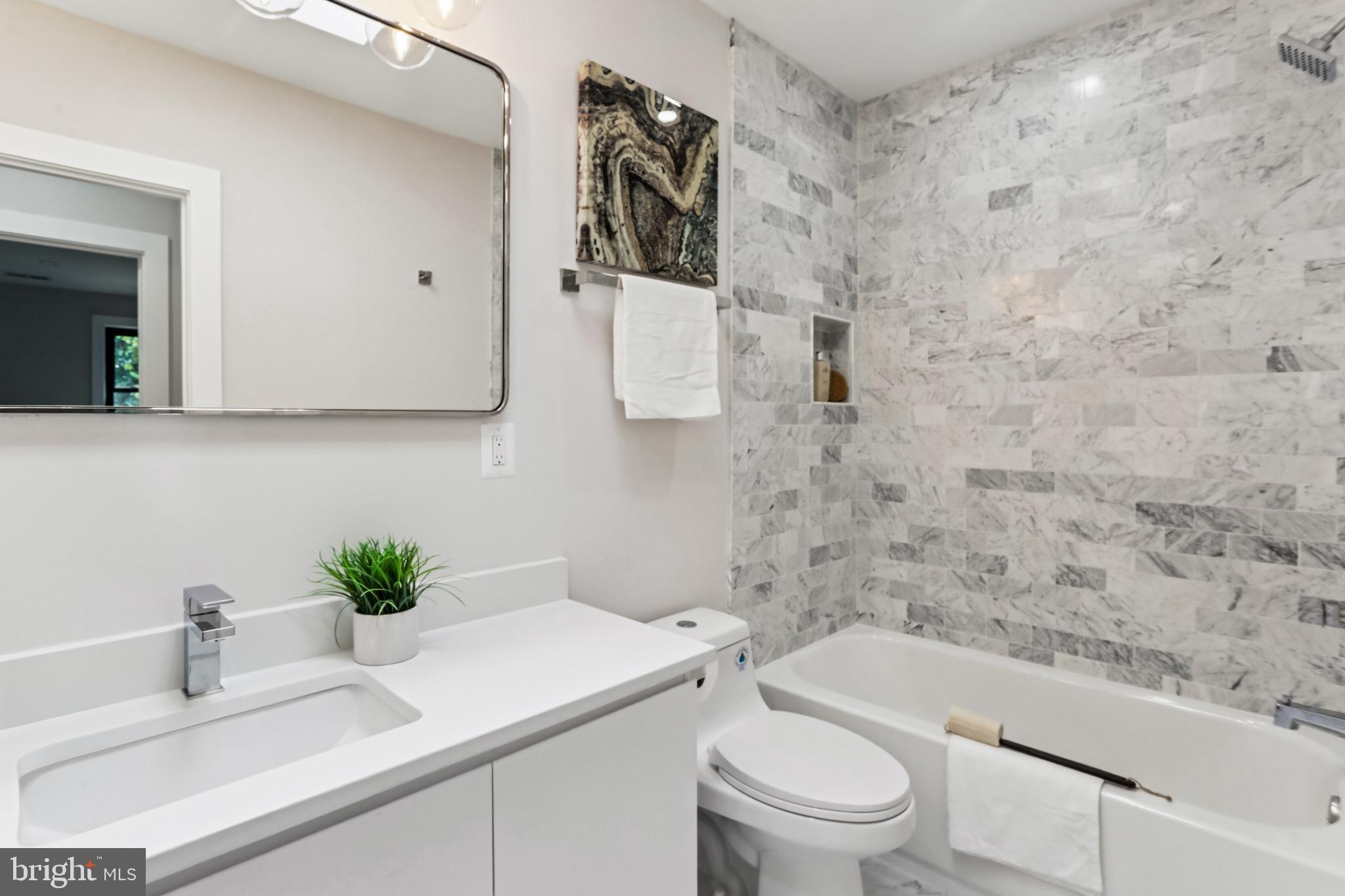 208 Webster Street Northwest Washington, DC 20011 - Photo 26 of 46 a bathroom with a sink a toilet and shower