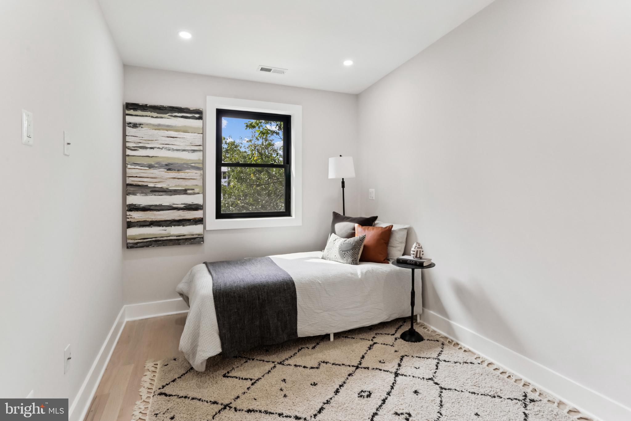 208 Webster Street Northwest Washington, DC 20011 - Photo 28 of 46 a bedroom with a bed and a window