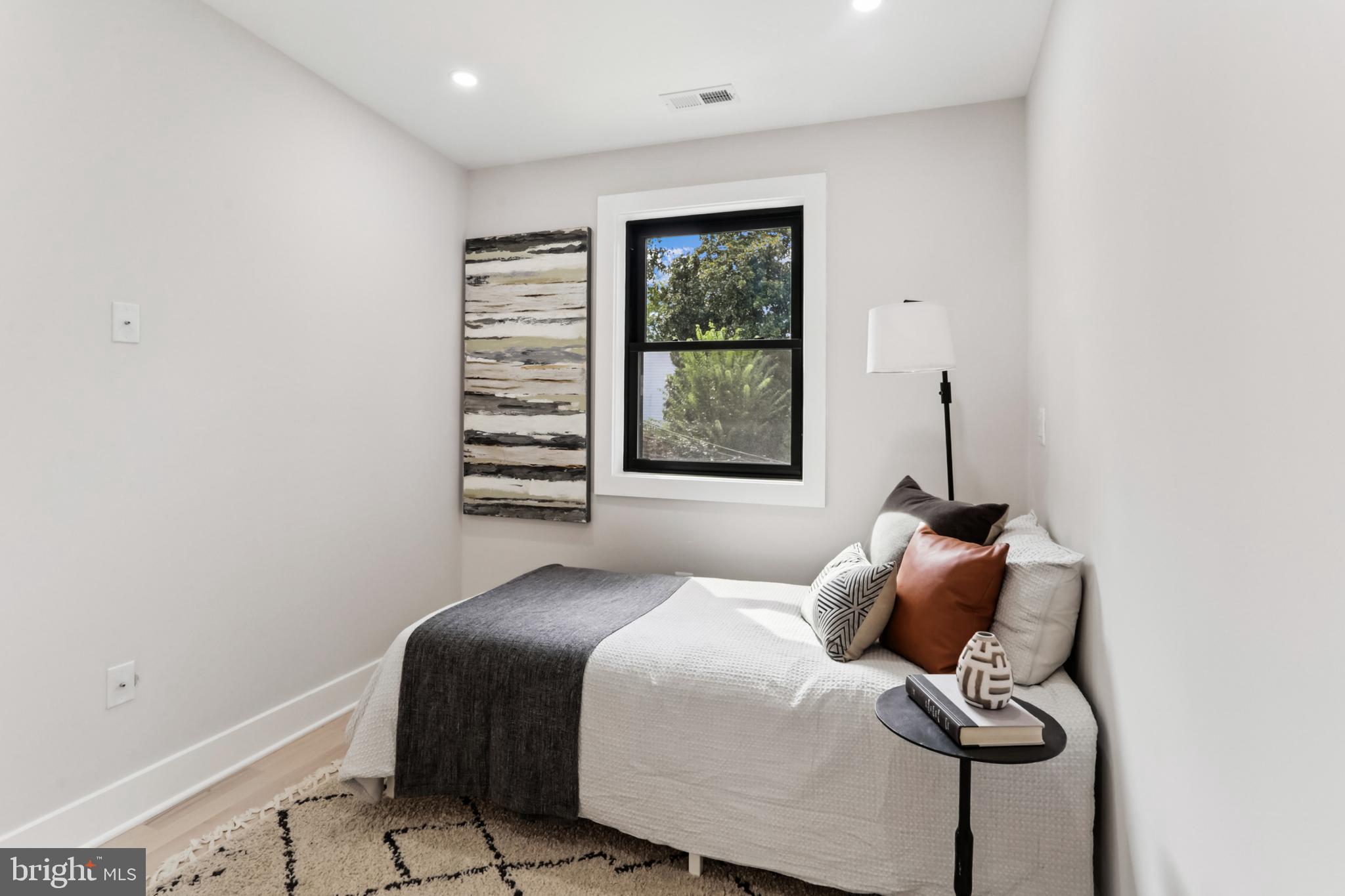 208 Webster Street Northwest Washington, DC 20011 - Photo 29 of 46 a bedroom with a bed and a window