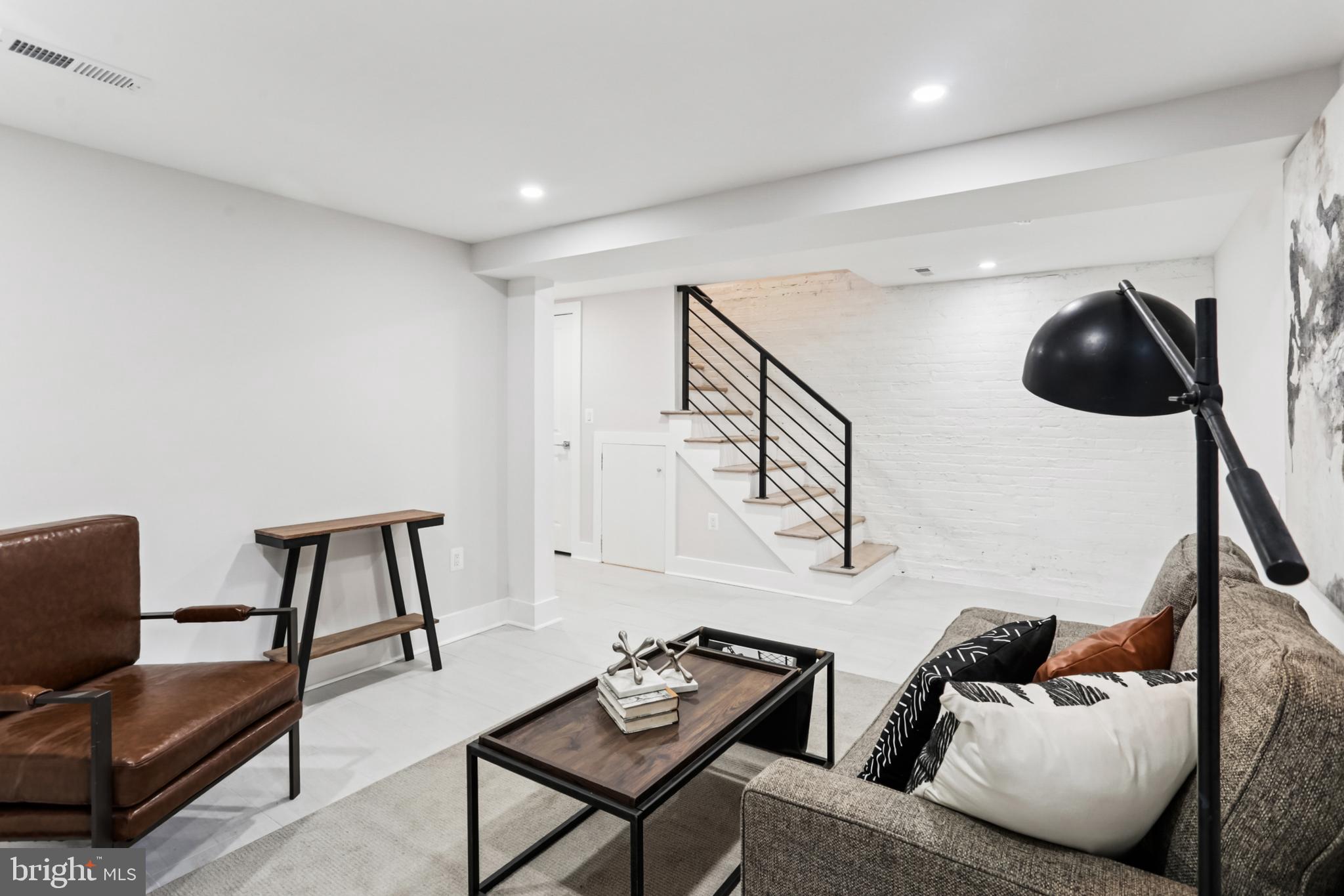 208 Webster Street Northwest Washington, DC 20011 - Photo 33 of 46 a living room with furniture and a chair