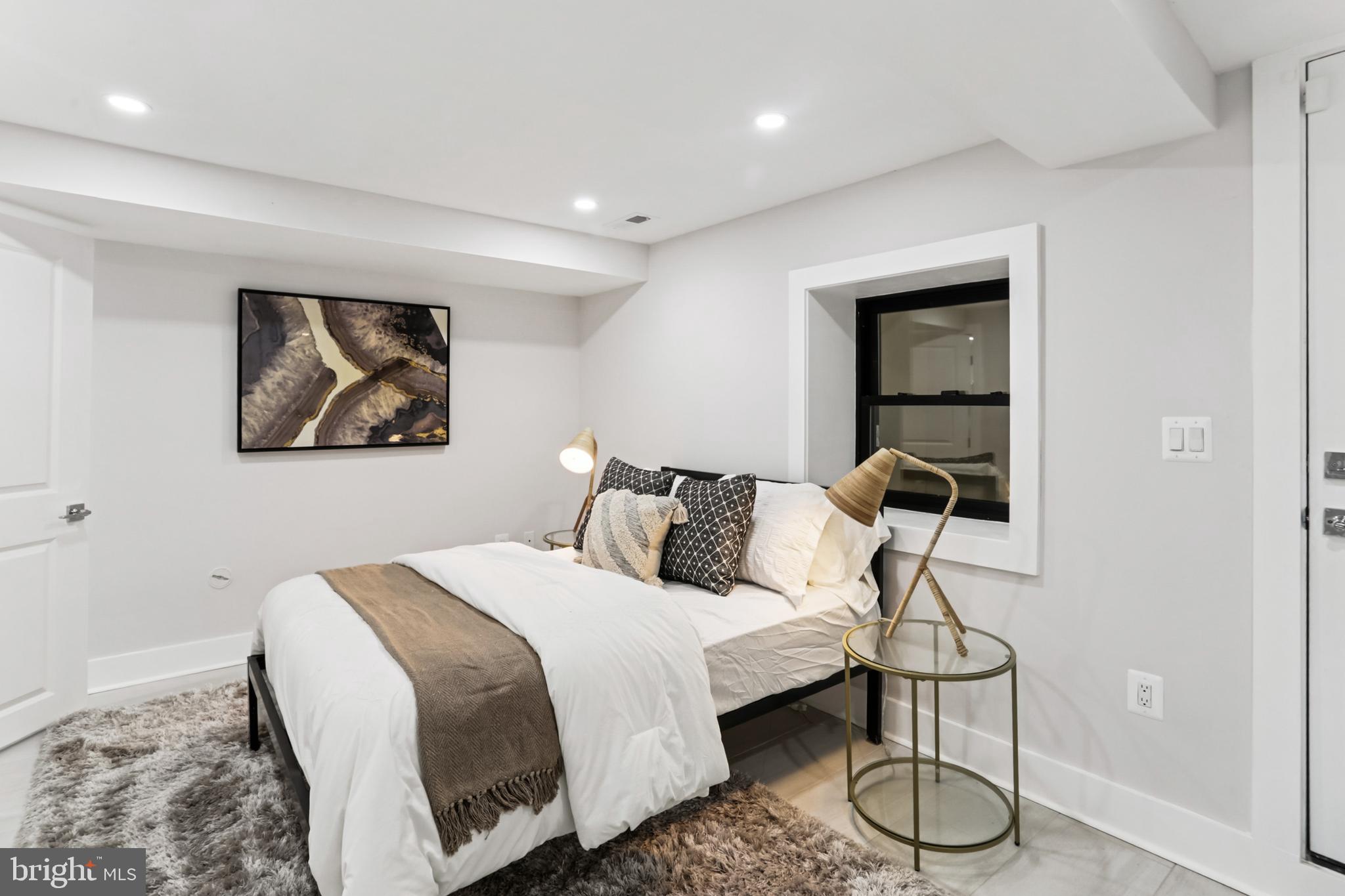 208 Webster Street Northwest Washington, DC 20011 - Photo 35 of 46 a bedroom with a bed and a painting on wall