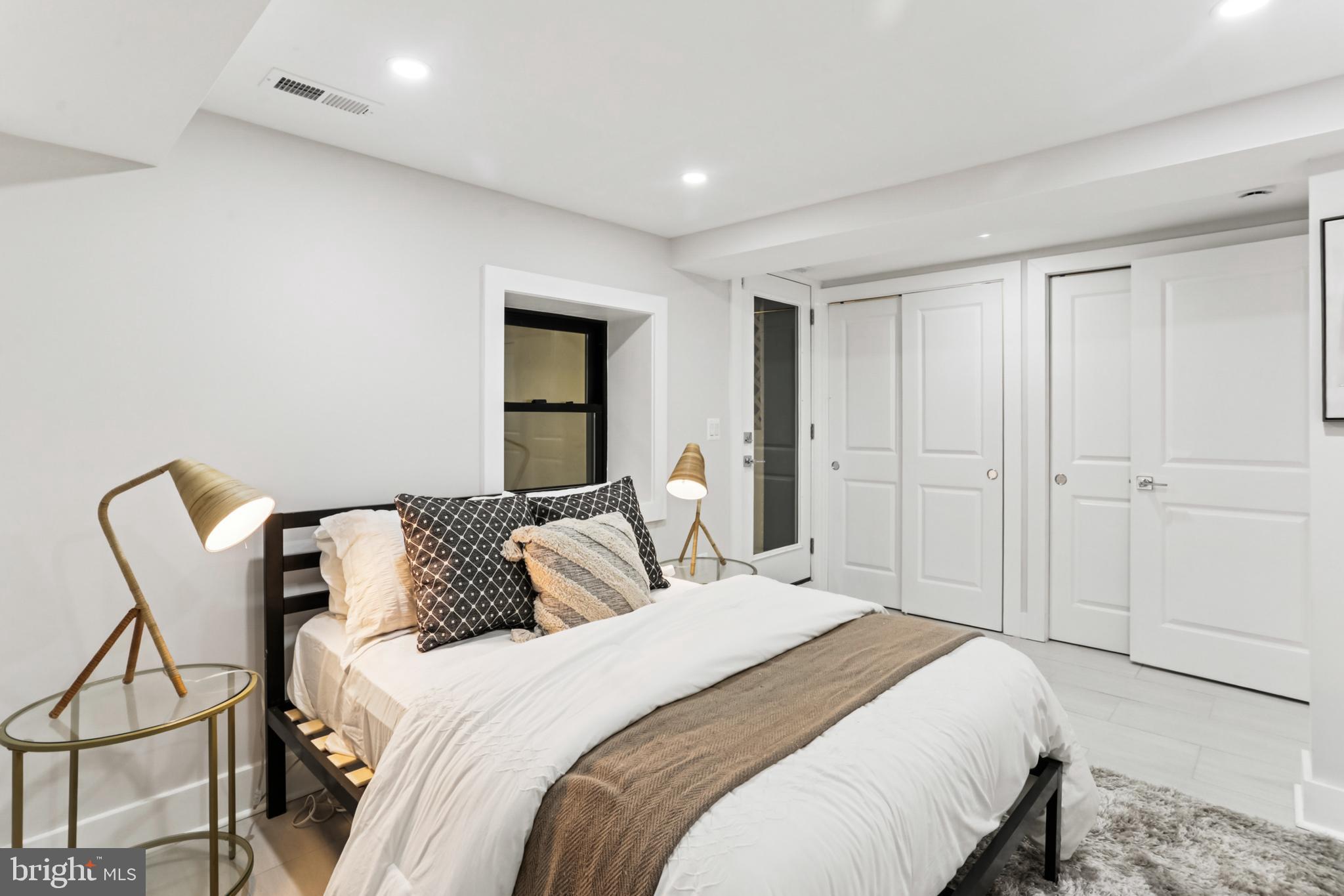 208 Webster Street Northwest Washington, DC 20011 - Photo 36 of 46 a bedroom with a bed and a chair