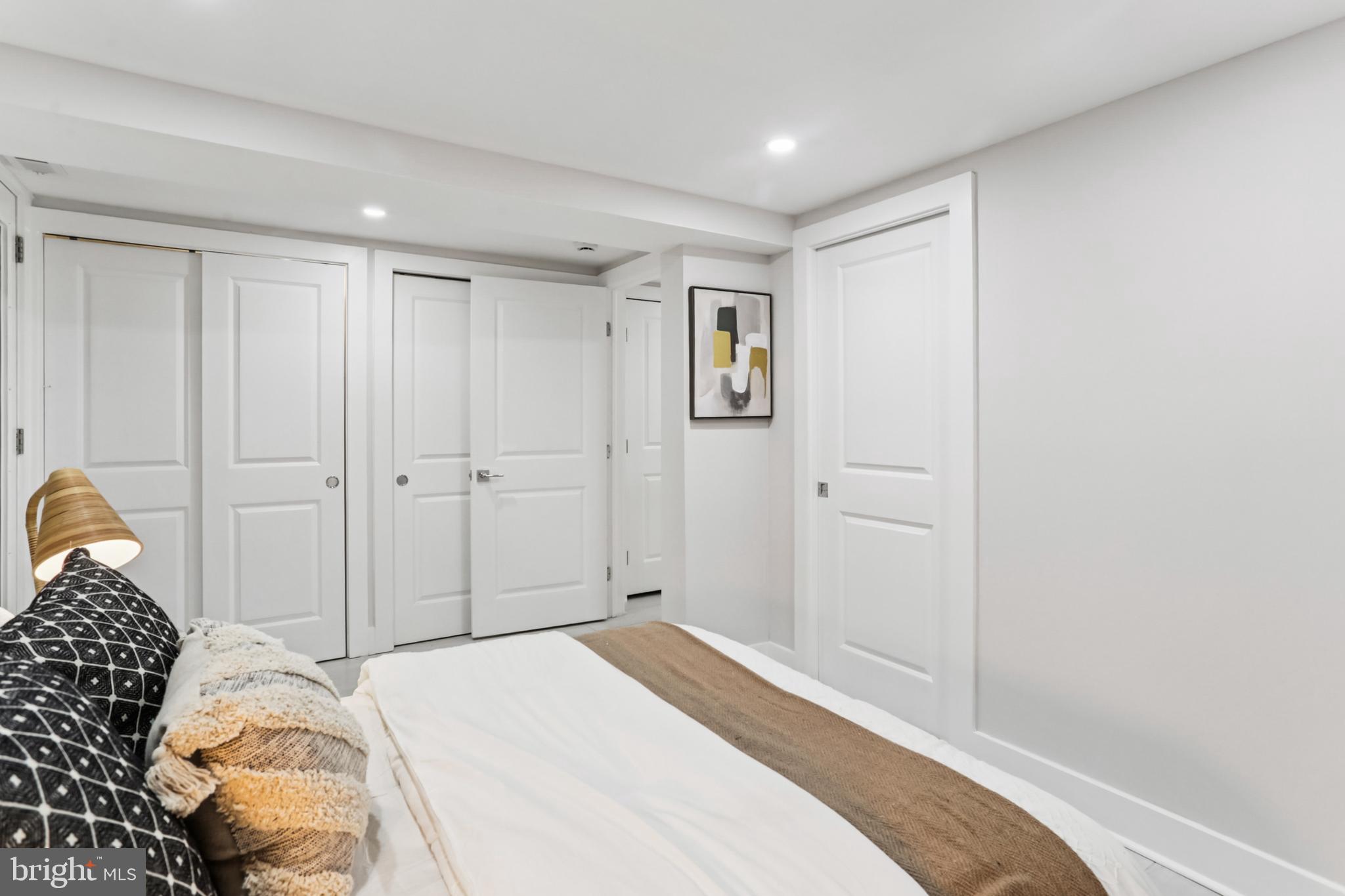 208 Webster Street Northwest Washington, DC 20011 - Photo 37 of 46 a bedroom with a bed and a window