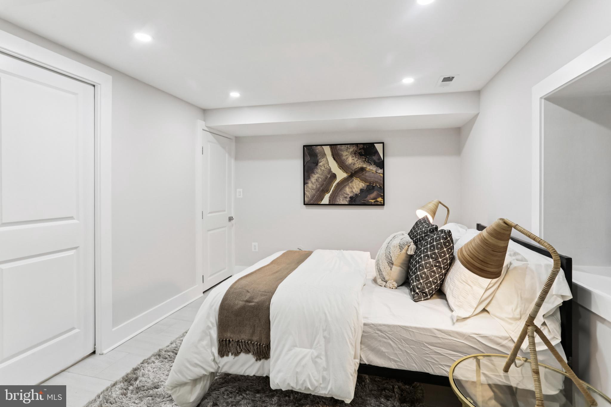 208 Webster Street Northwest Washington, DC 20011 - Photo 38 of 46 a bedroom with a bed and painting on the wall