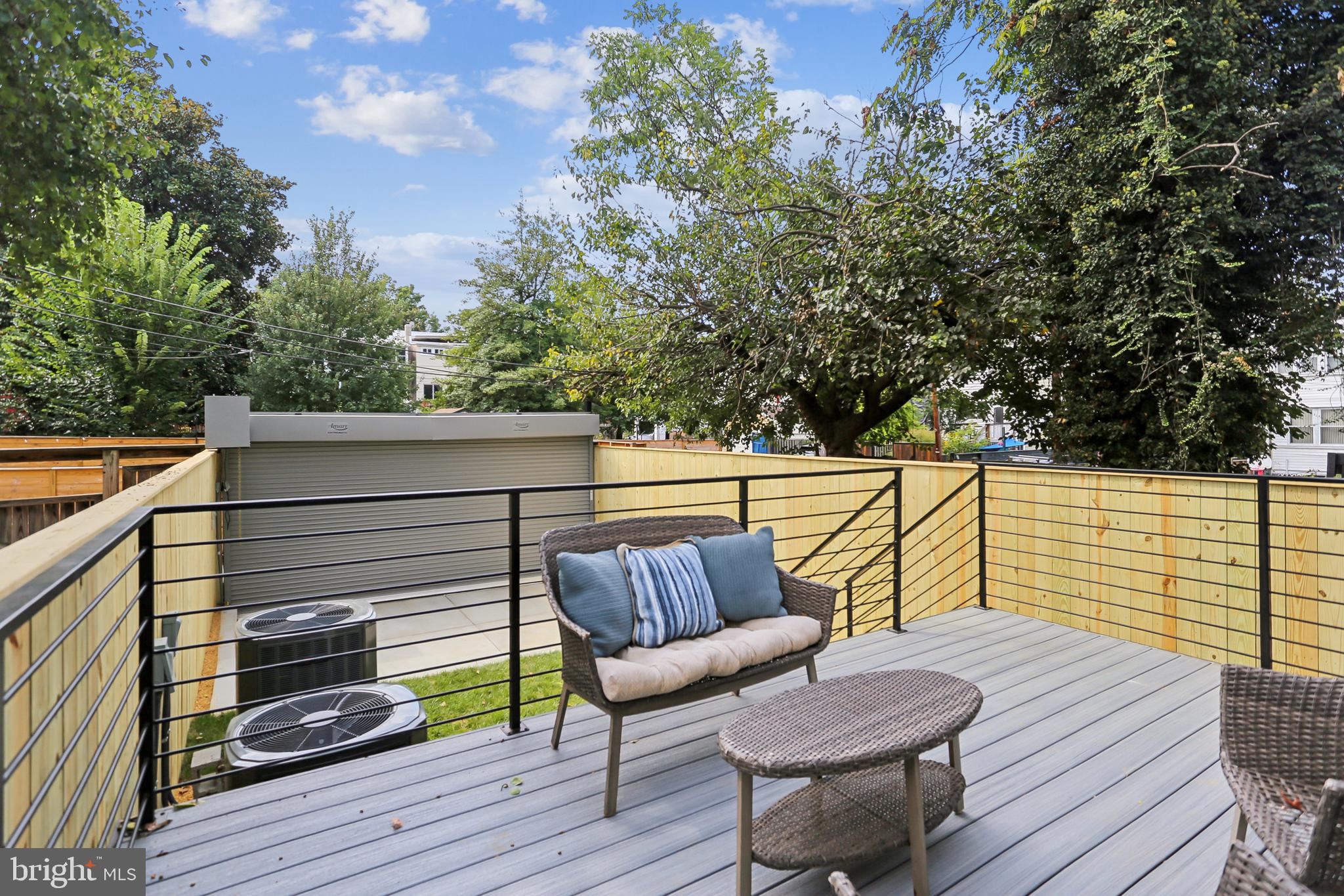 208 Webster Street Northwest Washington, DC 20011 - Photo 42 of 46 a roof deck with wooden floor and fence