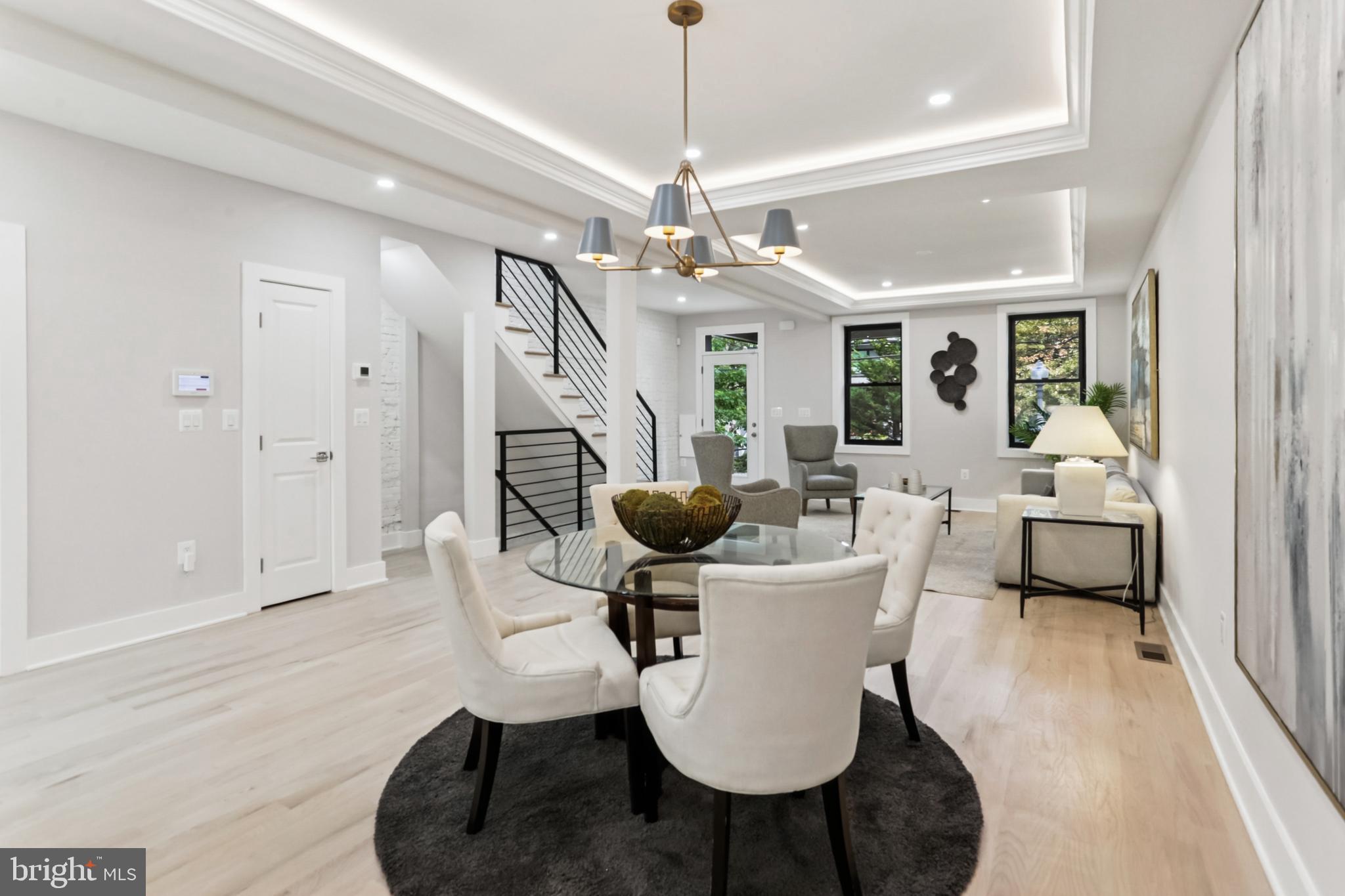 208 Webster Street Northwest Washington, DC 20011 - Photo 5 of 46 a living room with fireplace furniture and a chandelier