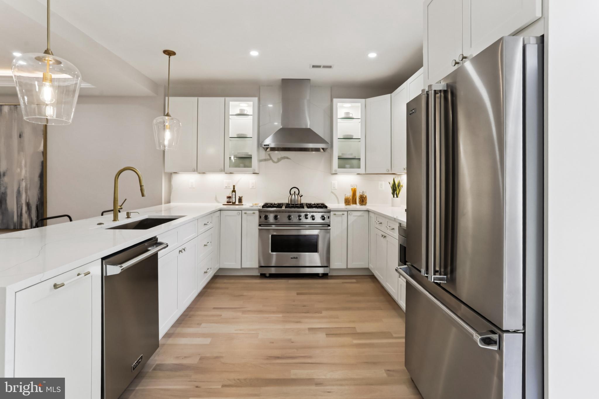 208 Webster Street Northwest Washington, DC 20011 - Photo 9 of 46 a kitchen with stainless steel appliances granite countertop a refrigerator a sink and a stove