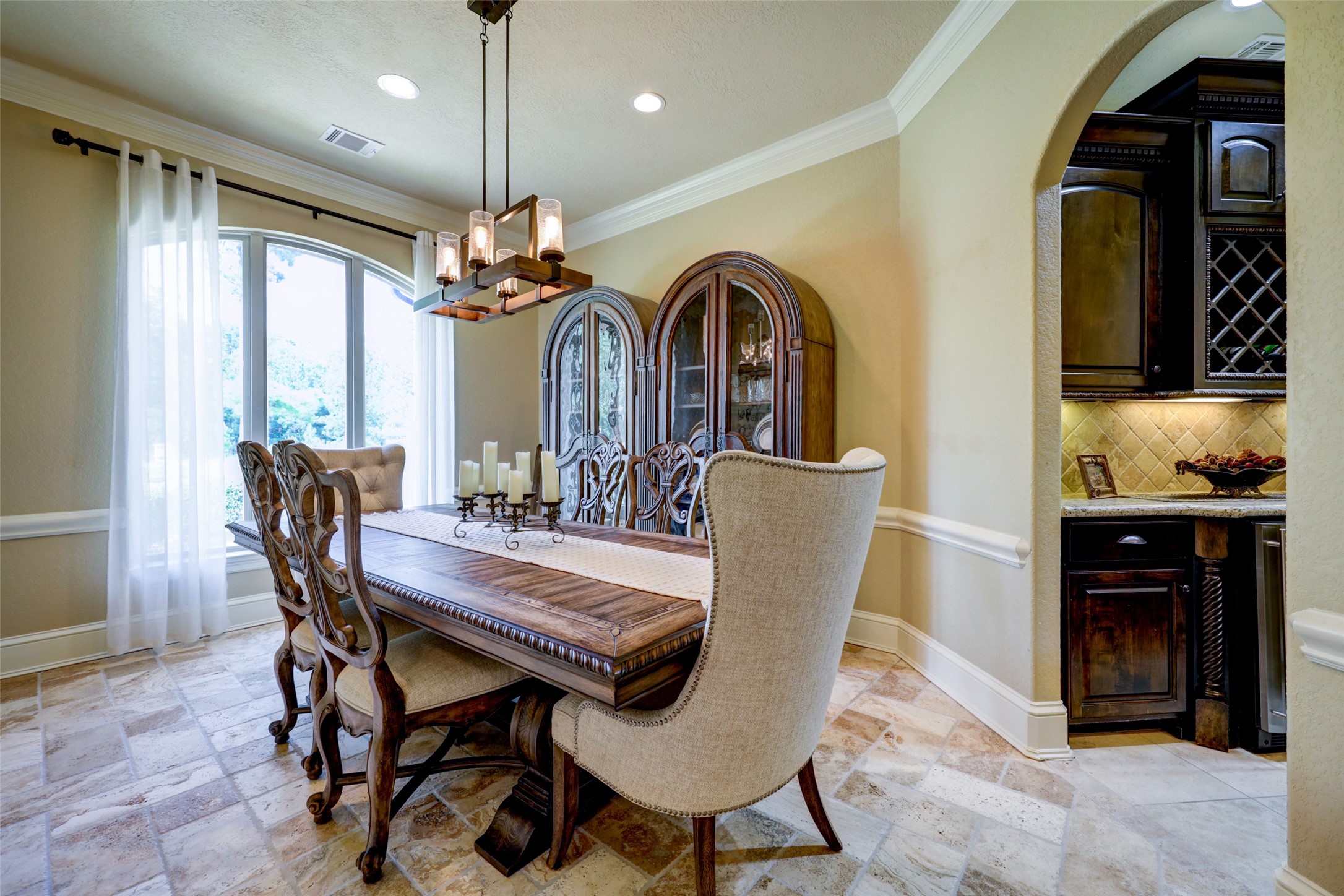 4434 Chateau Creek Way Spring, TX 77386 - Photo 12 of 34 The formal dining room with direct access to a full butler pantry/bar area featuring a wine cooler, beverage cooler, ice machine, and sink.