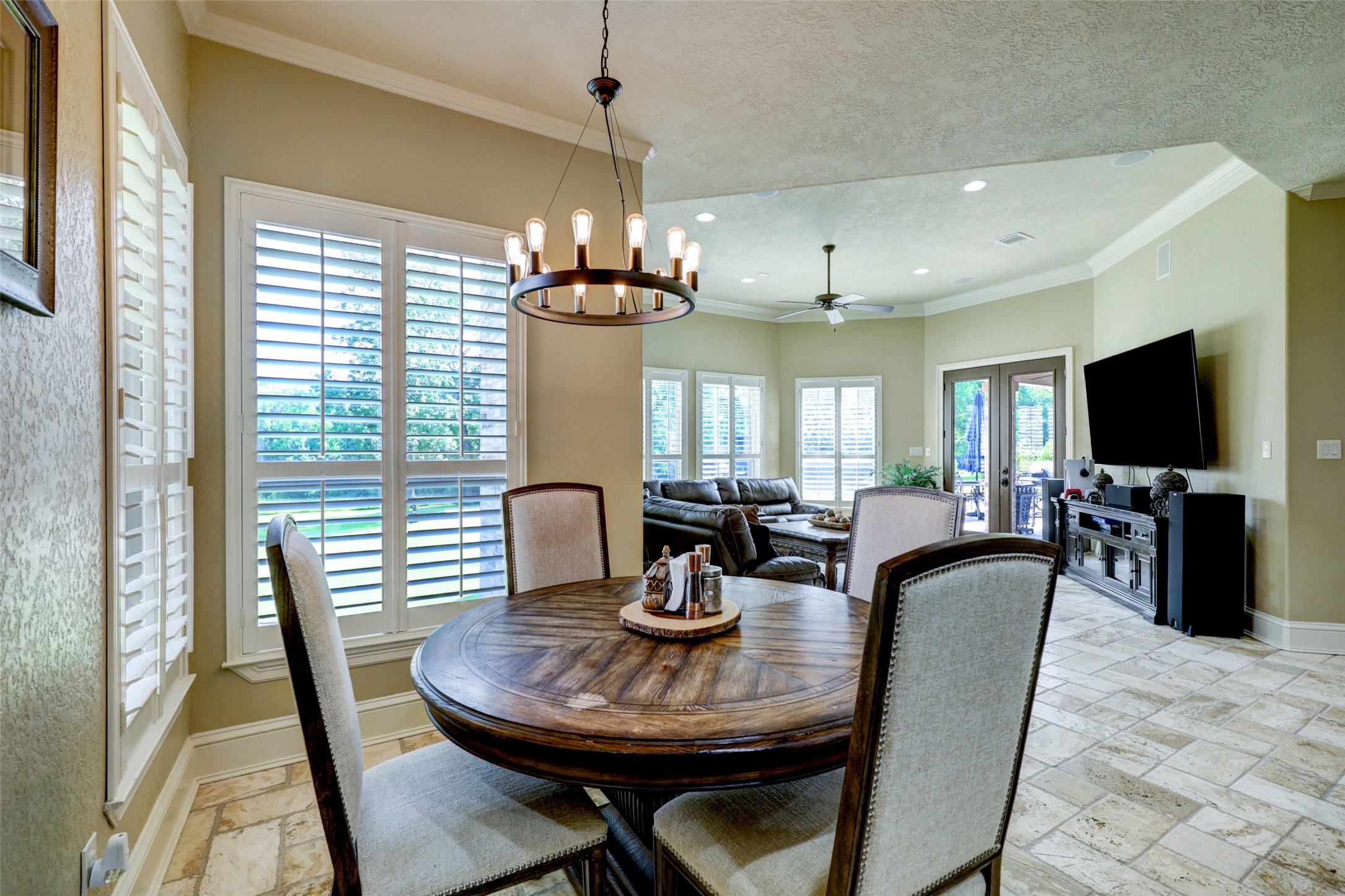 4434 Chateau Creek Way Spring, TX 77386 - Photo 17 of 34 A view of the breakfast nook looking into the living room that leads to the outdoor pool and spa.