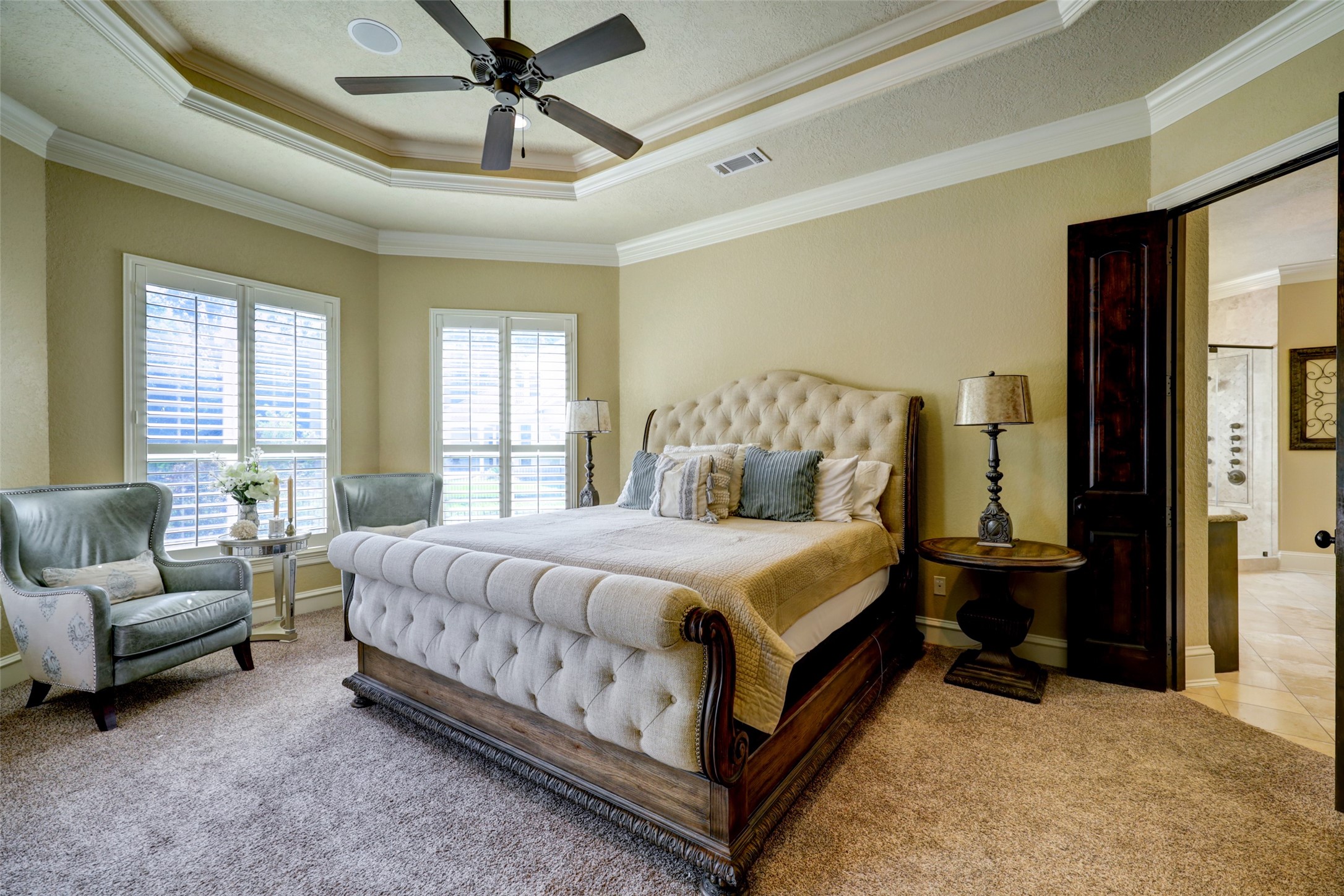 4434 Chateau Creek Way Spring, TX 77386 - Photo 22 of 34 The primary bedroom and ensuite bathroom are located on the first floor of the home.