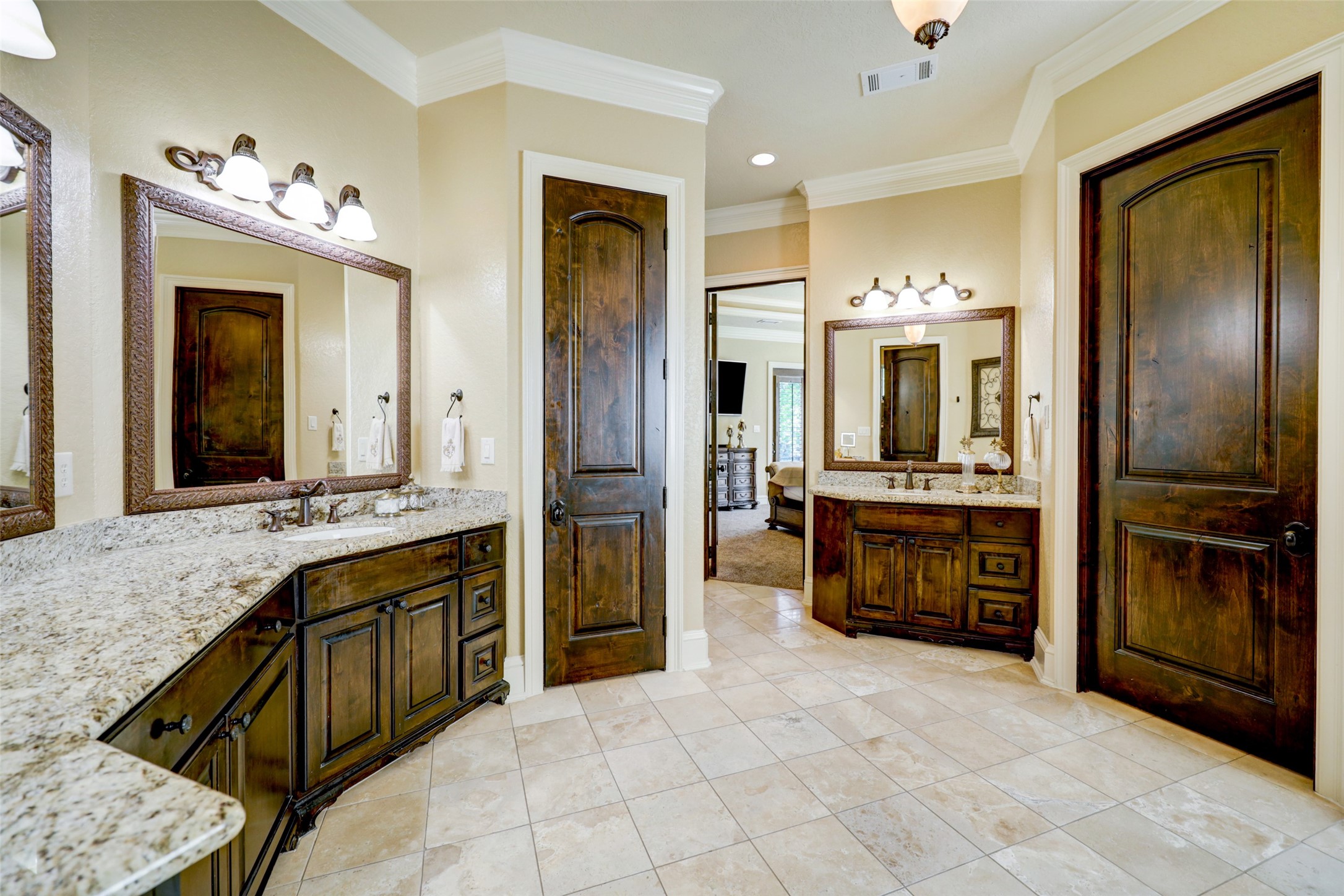 4434 Chateau Creek Way Spring, TX 77386 - Photo 25 of 34 The primary ensuite has double sinks with ample storage and two oversized walk-in closets.