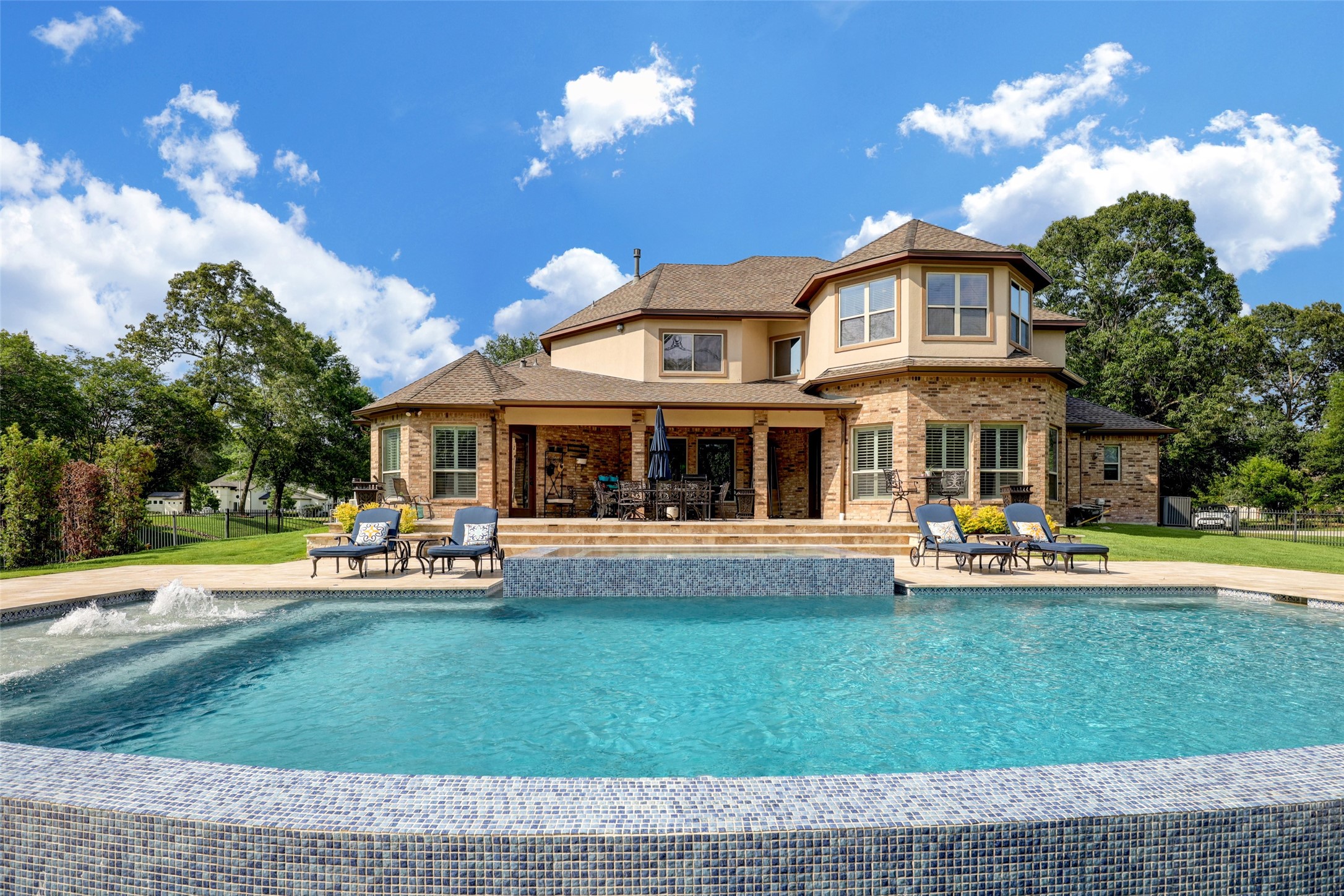 4434 Chateau Creek Way Spring, TX 77386 - Photo 3 of 34 This oversized custom infinity pool is perfect for swimming in the Texas heat.