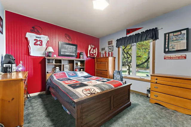 a bed room with a bed and a table