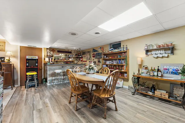 a view of a dining room with furniture and wooden floor