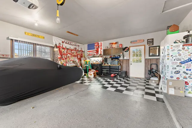 a bedroom with furniture and a book shelf