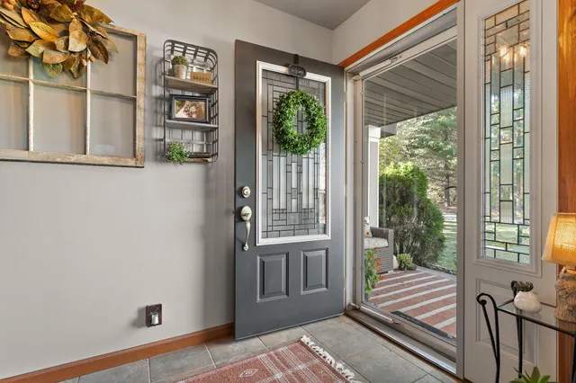 a view of a room that has a window and storage