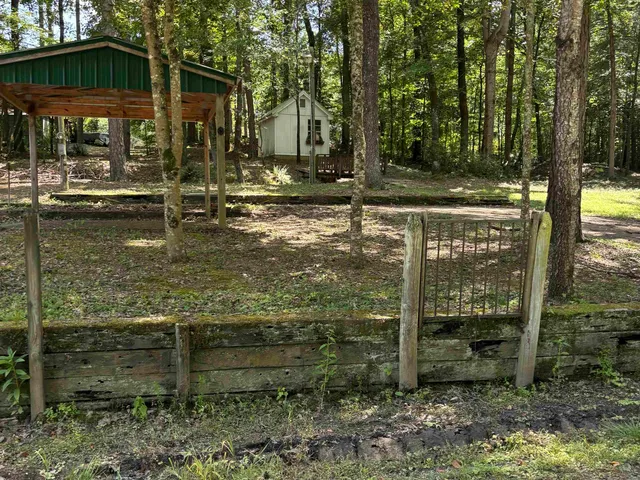 a backyard of a house with lots of green space