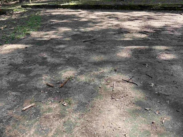 a view of a table and chairs under an umbrella