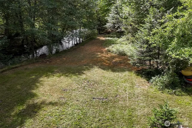a view of a lake from a yard