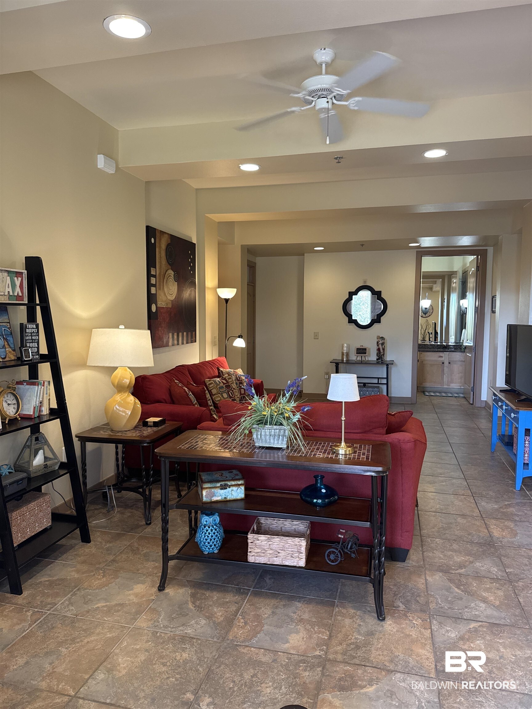 1430 Regency Road, Unit C101 Gulf Shores, AL 36542 - Photo 6 of 32 Living area with a ceiling fan, recessed lighting, and stone finish flooring