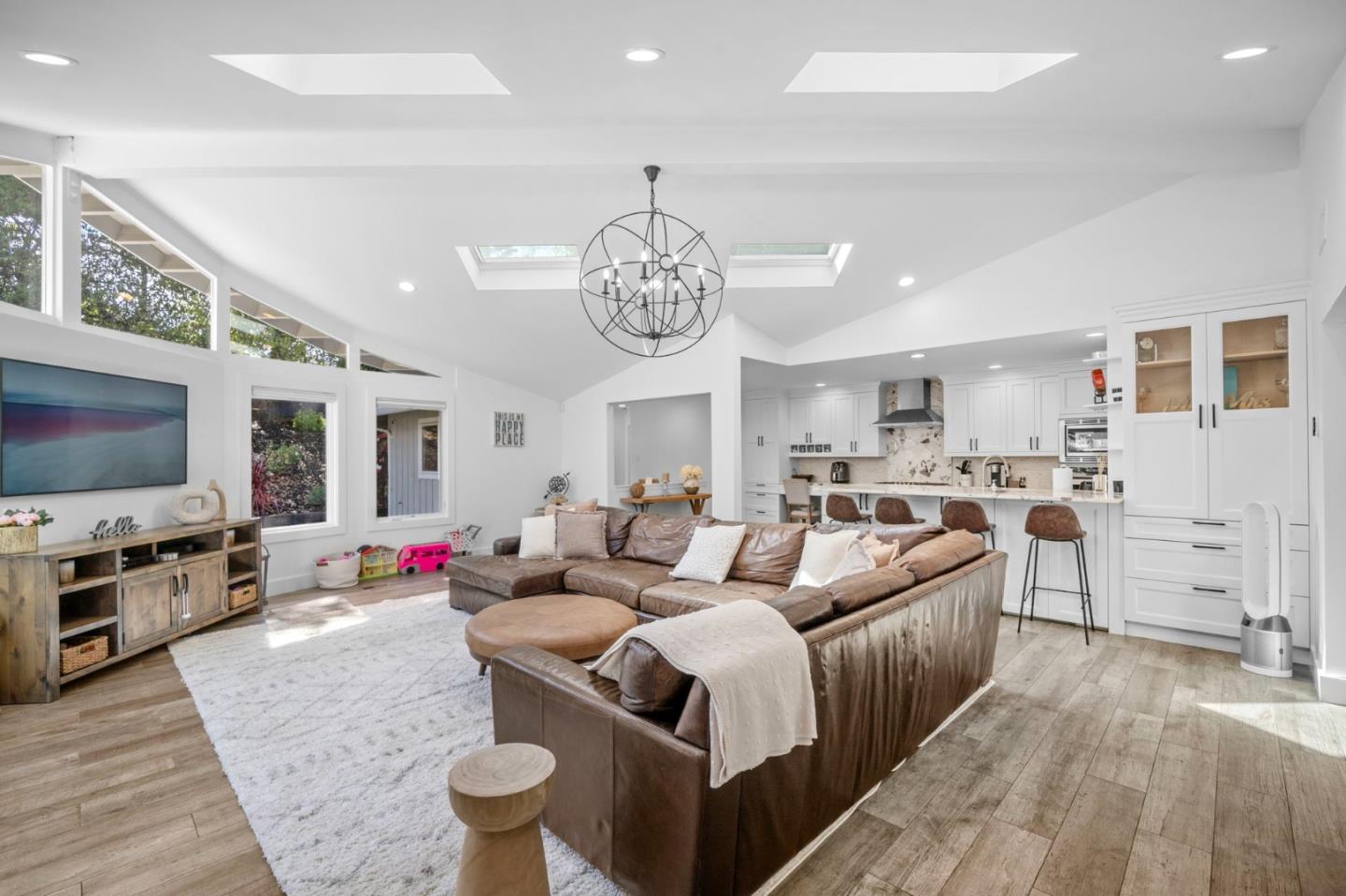 575 Darrell Road Hillsborough, CA 94010 - Photo 17 of 75 a living room with furniture and a flat screen tv