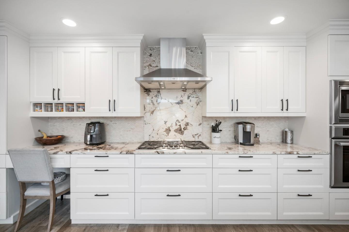 575 Darrell Road Hillsborough, CA 94010 - Photo 23 of 75 a kitchen with cabinets appliances and a counter space